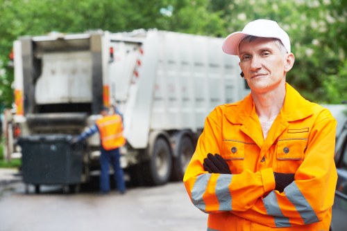 Builders loading waste for clearance in Cricklewood