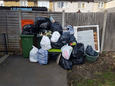 Professional garden clearance team at work in a Cricklewood garden